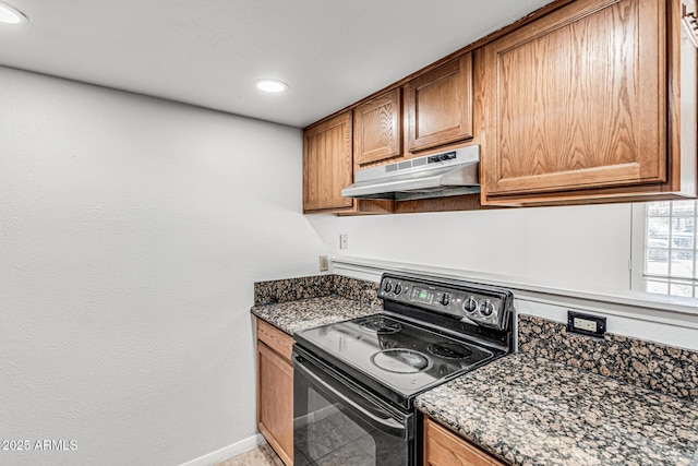 kitchen featuring black electric range oven, baseboards, recessed lighting, under cabinet range hood, and brown cabinets