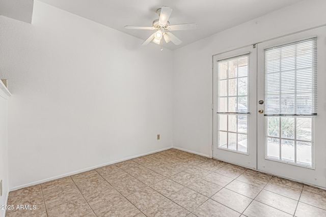 interior space with light tile patterned floors, baseboards, a ceiling fan, and french doors