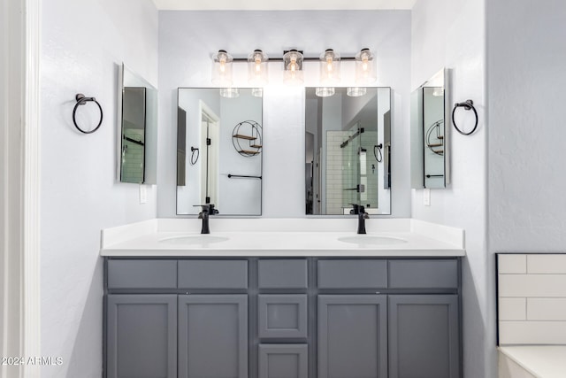 bathroom featuring an enclosed shower and vanity