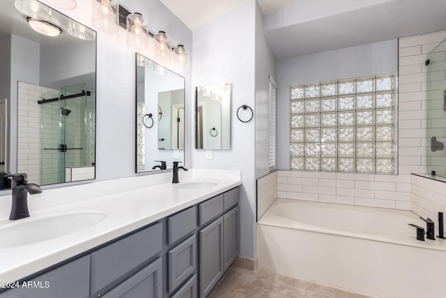 bathroom with vanity, tile patterned floors, and separate shower and tub