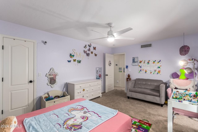 bedroom featuring ceiling fan and carpet