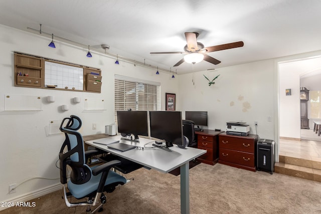 office area featuring light carpet and ceiling fan