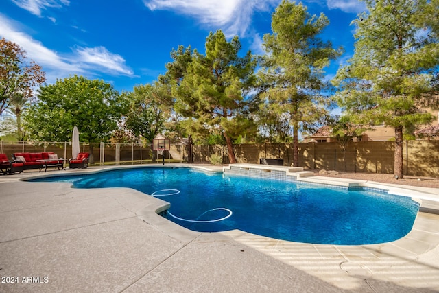 view of swimming pool with a patio area