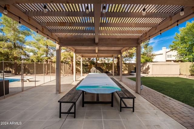 view of patio / terrace featuring a shed, a pergola, and a pool