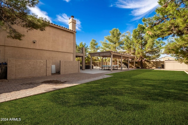 view of yard with a pergola and a patio area