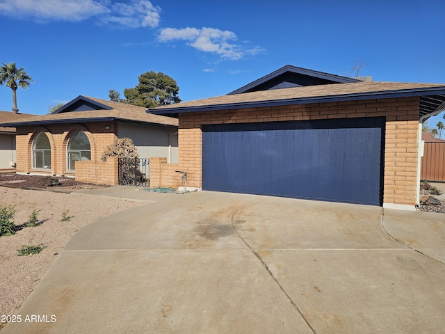 ranch-style home featuring a garage