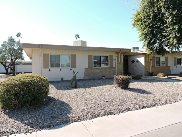 ranch-style home with central AC