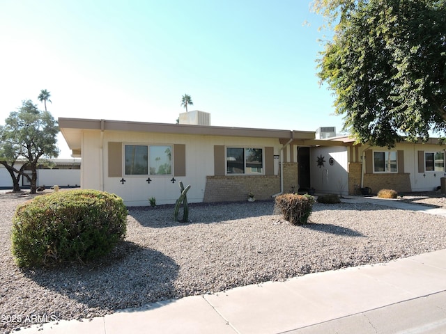 ranch-style house featuring central air condition unit