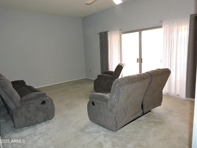 living room with light carpet and ceiling fan