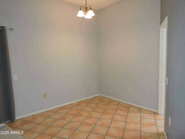 empty room with a notable chandelier