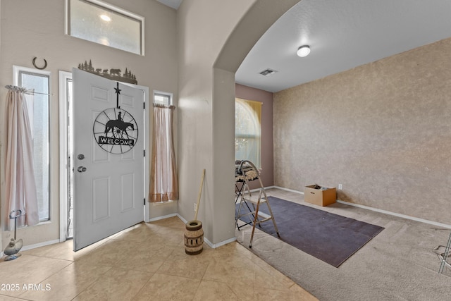 entryway featuring light tile patterned floors