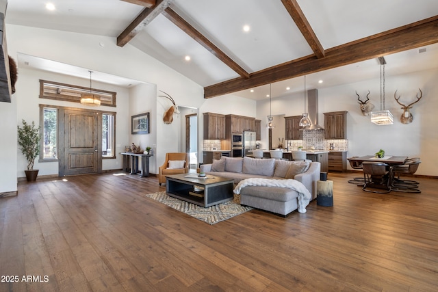 living room with dark wood-type flooring, high vaulted ceiling, and beamed ceiling