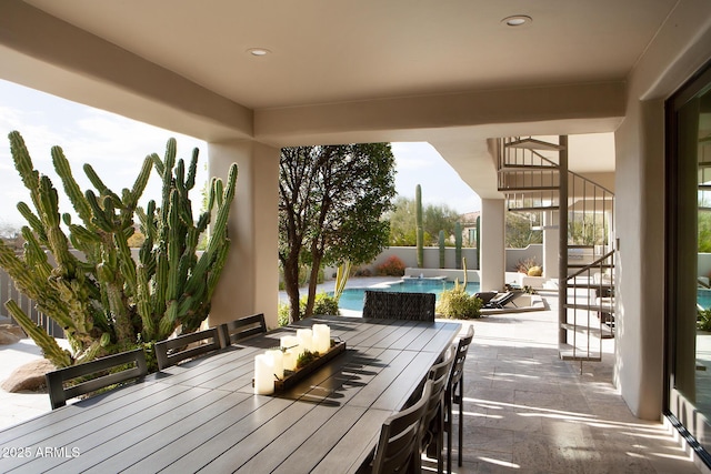 view of patio featuring a fenced in pool