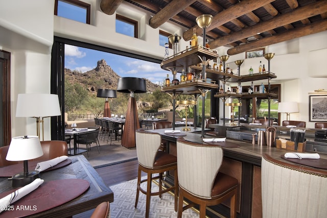 interior space featuring outdoor wet bar, exterior kitchen, and outdoor dining area