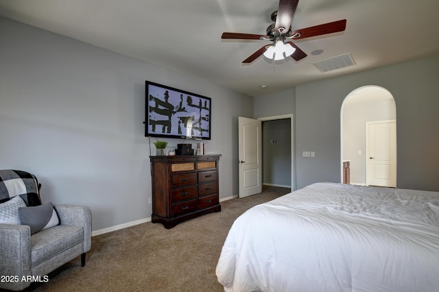 1527 Bainbridge Ln, Chino Valley, AZ 86323 - bedroom featuring carpet flooring, arched walkways, baseboards, and a ceiling fan