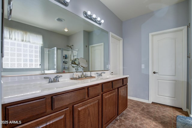 1527 Bainbridge Ln, Chino Valley, AZ 86323 - full bath featuring a shower stall, double vanity, tile patterned flooring, and baseboards