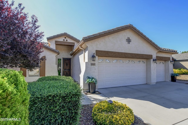 1527 Bainbridge Ln, Chino Valley, AZ 86323 - mediterranean / spanish house with a garage, stucco siding, and concrete driveway