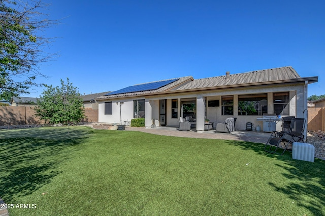 1527 Bainbridge Ln, Chino Valley, AZ 86323 - back of property with solar panels, a patio, a tile roof, and stucco siding