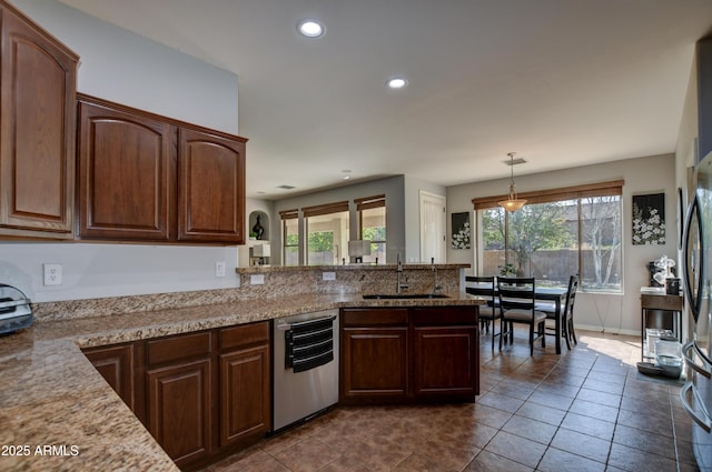1527 Bainbridge Ln, Chino Valley, AZ 86323 - kitchen with stainless steel dishwasher, a sink, recessed lighting, a peninsula, and dark tile patterned flooring