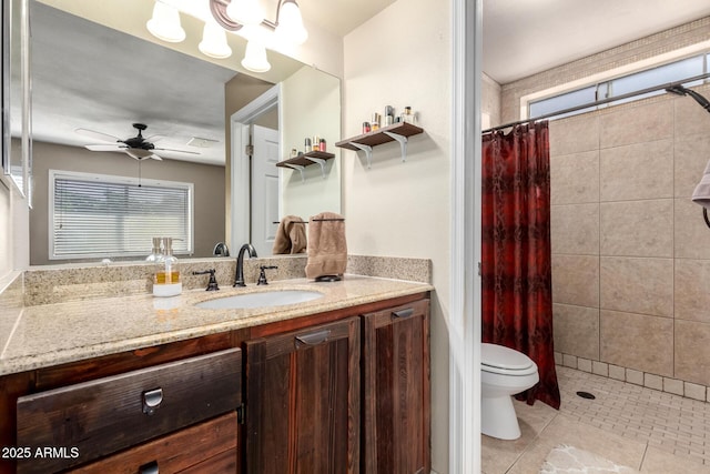 full bathroom featuring toilet, tile patterned flooring, a tile shower, vanity, and a healthy amount of sunlight