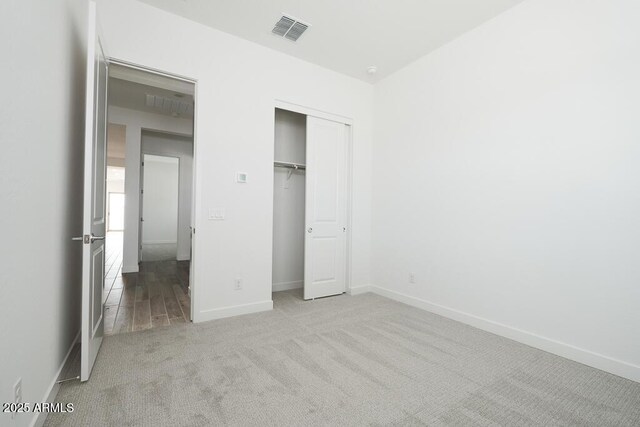 352 E Las Perlas Ln, San Tan Valley, AZ 85140 - unfurnished bedroom featuring carpet floors, baseboards, and a closet