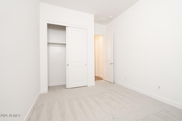 352 E Las Perlas Ln, San Tan Valley, AZ 85140 - unfurnished bedroom featuring carpet floors, a closet, and baseboards