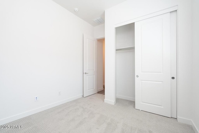 352 E Las Perlas Ln, San Tan Valley, AZ 85140 - unfurnished bedroom featuring light colored carpet, a closet, and baseboards