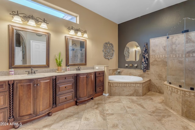 bathroom with tile patterned flooring, separate shower and tub, and vanity