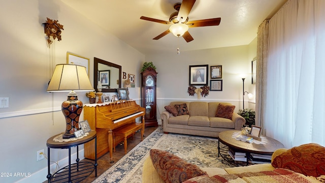 living room with ceiling fan and hardwood / wood-style floors