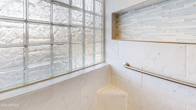 bathroom with tile walls