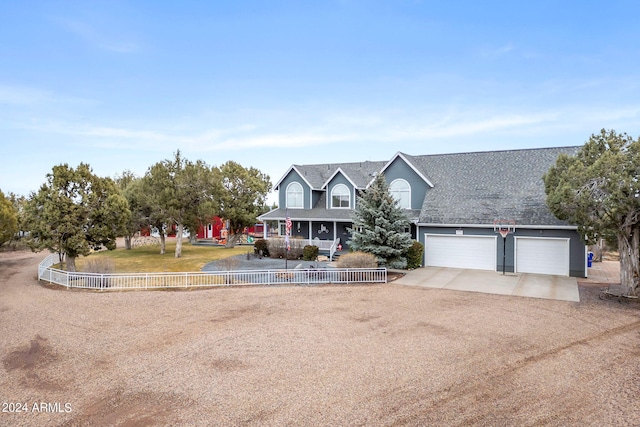 view of front of house featuring a front yard and a garage