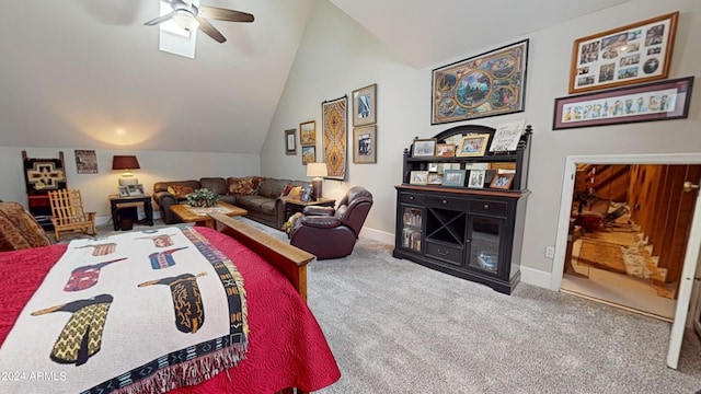 bedroom with light colored carpet, vaulted ceiling, and ceiling fan