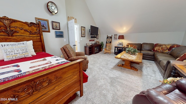 bedroom featuring lofted ceiling and light colored carpet