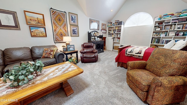 carpeted living room featuring high vaulted ceiling