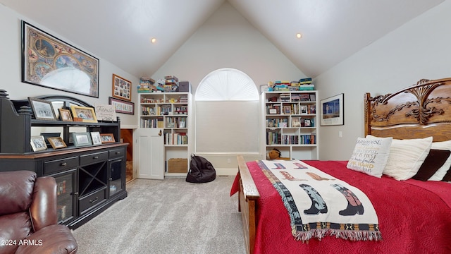 bedroom featuring high vaulted ceiling and light colored carpet