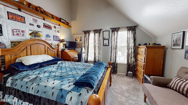 bedroom featuring light colored carpet and lofted ceiling