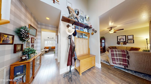 living room with hardwood / wood-style floors and ceiling fan