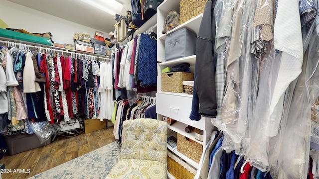 walk in closet featuring dark hardwood / wood-style floors