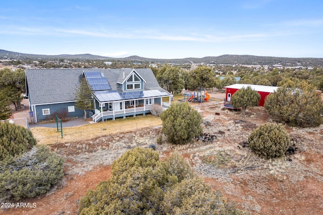 birds eye view of property featuring a mountain view