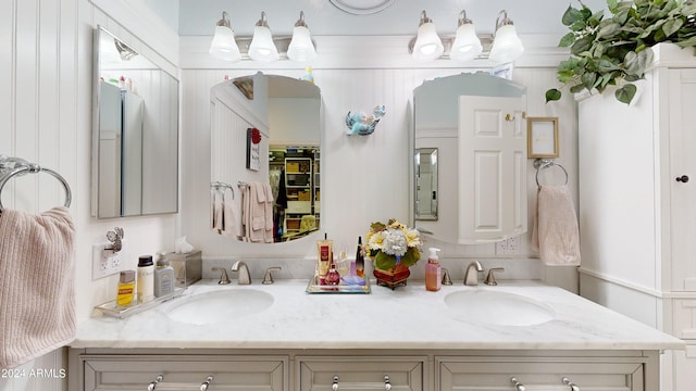 bathroom featuring large vanity and dual sinks