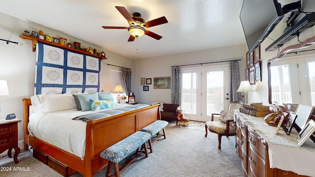 carpeted bedroom with ceiling fan, access to outside, french doors, and multiple windows