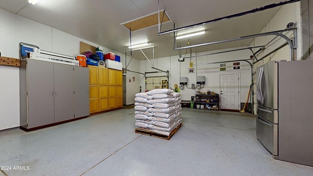 garage featuring stainless steel refrigerator