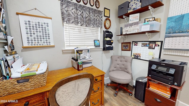 office area with light hardwood / wood-style floors