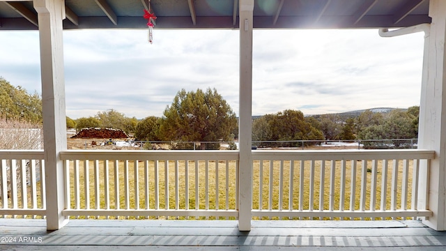 wooden deck with a yard