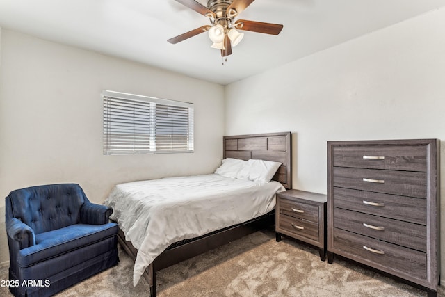 bedroom featuring a ceiling fan and light colored carpet