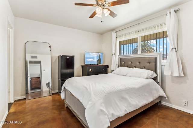 bedroom featuring ceiling fan, concrete floors, visible vents, and baseboards