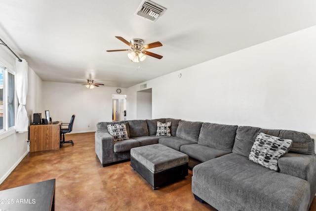 living area featuring ceiling fan, visible vents, and baseboards