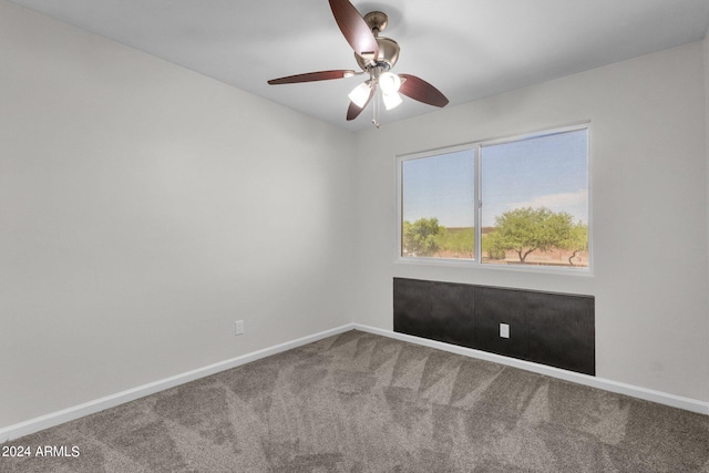 spare room with carpet and ceiling fan