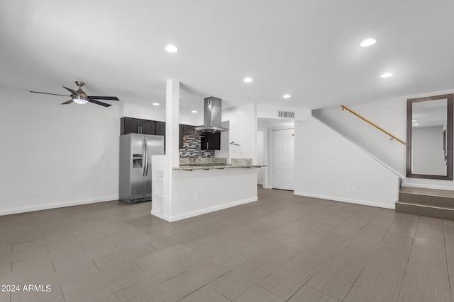 unfurnished living room with ceiling fan