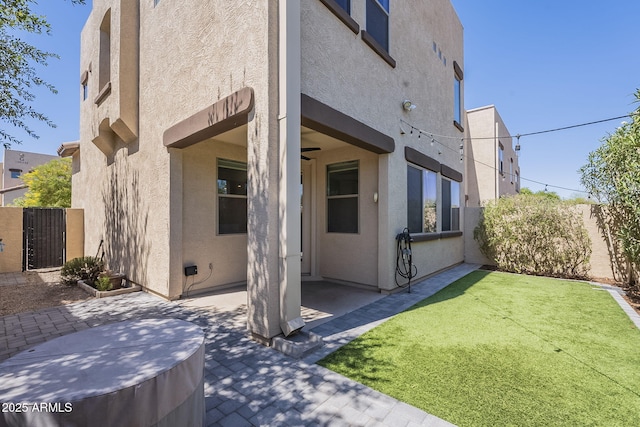 1886 E Don Carlos Ave Unit 136, Tempe, AZ 85281 - back of property with stucco siding and a patio